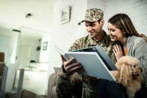Military family holding keys to new home – VA loan eligibility